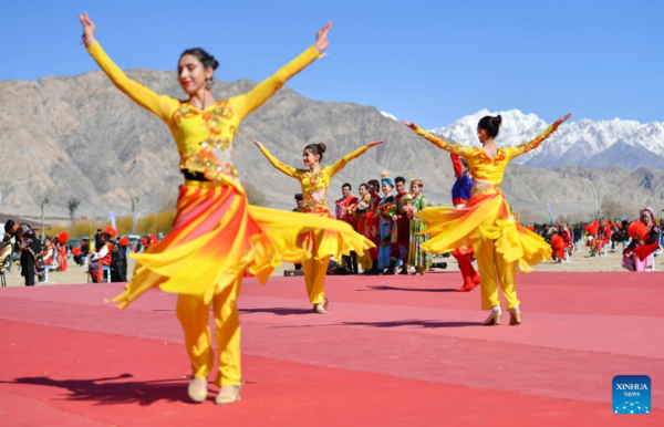 Ethnic Charm of Young Dancer Glows on Stage of Pamir Plateau
